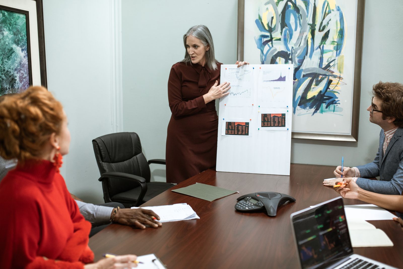 Senior executive presenting strategic options to board colleagues